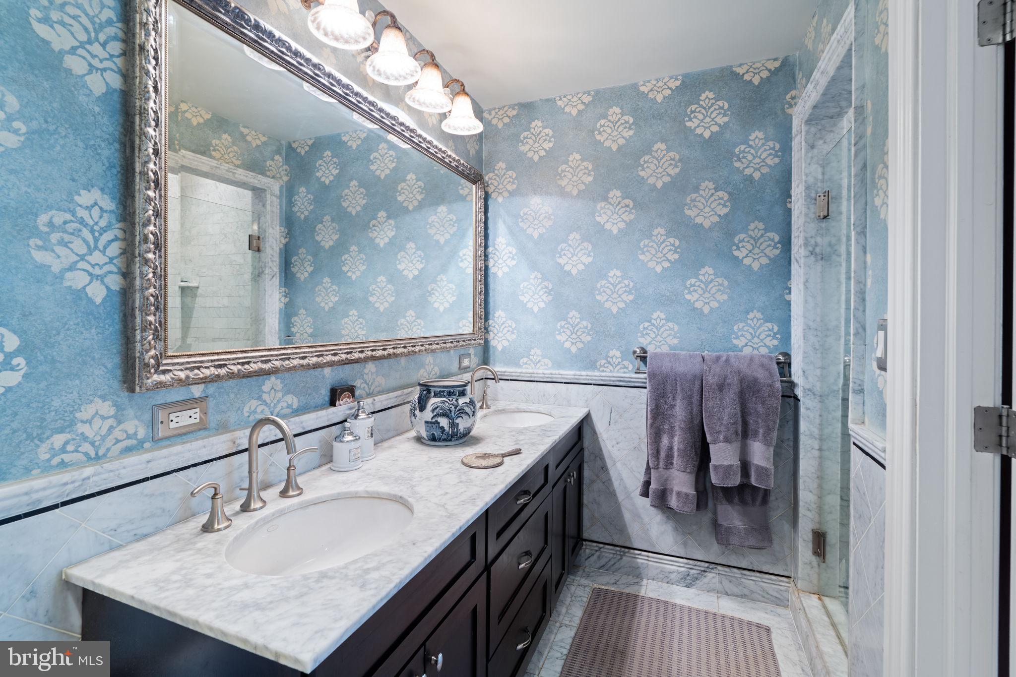 501 Pine Street Philadelphia, PA 19106 - Photo 35 of 52 a bathroom with a double vanity sink and a mirror