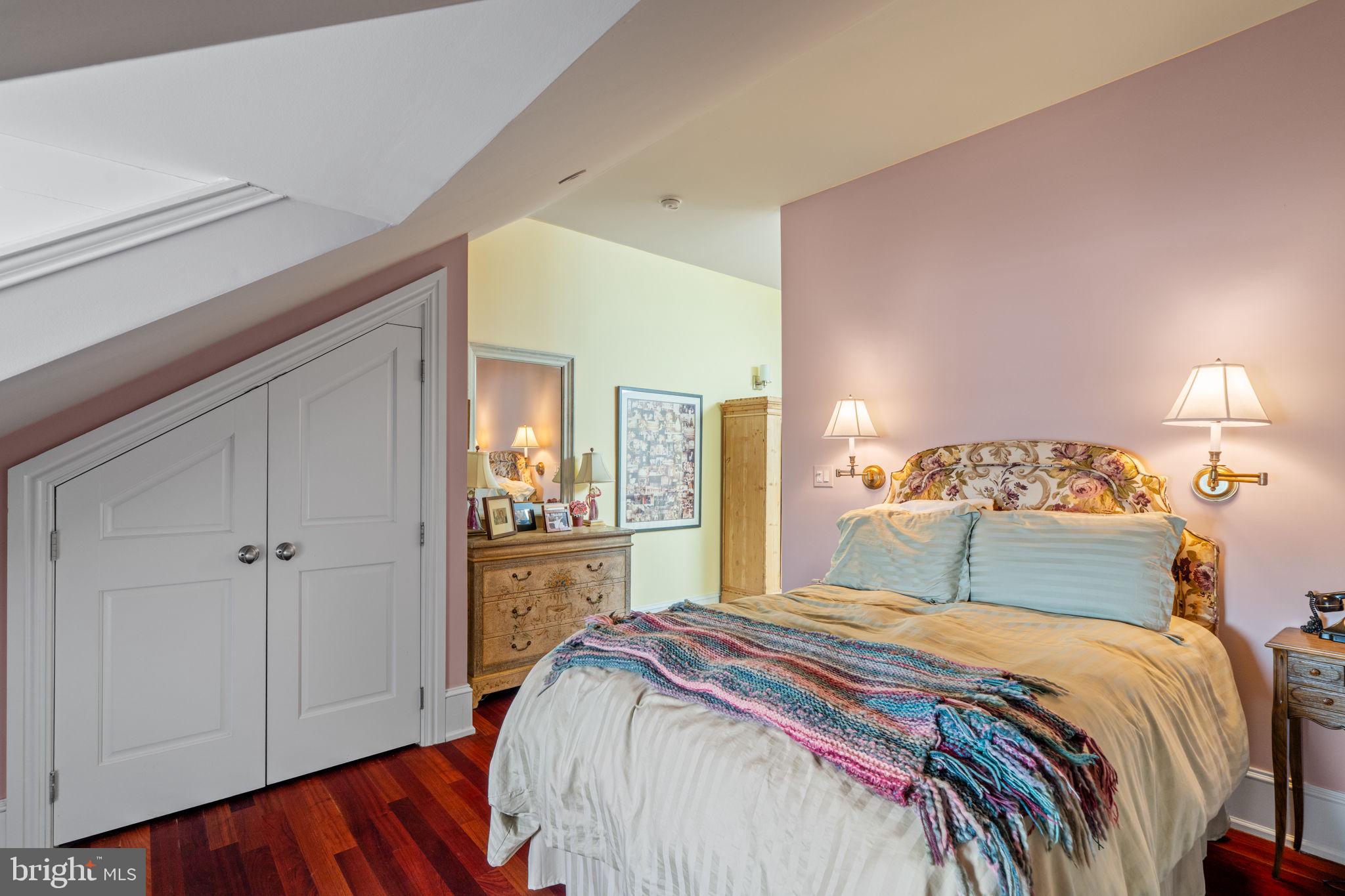 501 Pine Street Philadelphia, PA 19106 - Photo 49 of 52 a bedroom with a bed and wooden floor