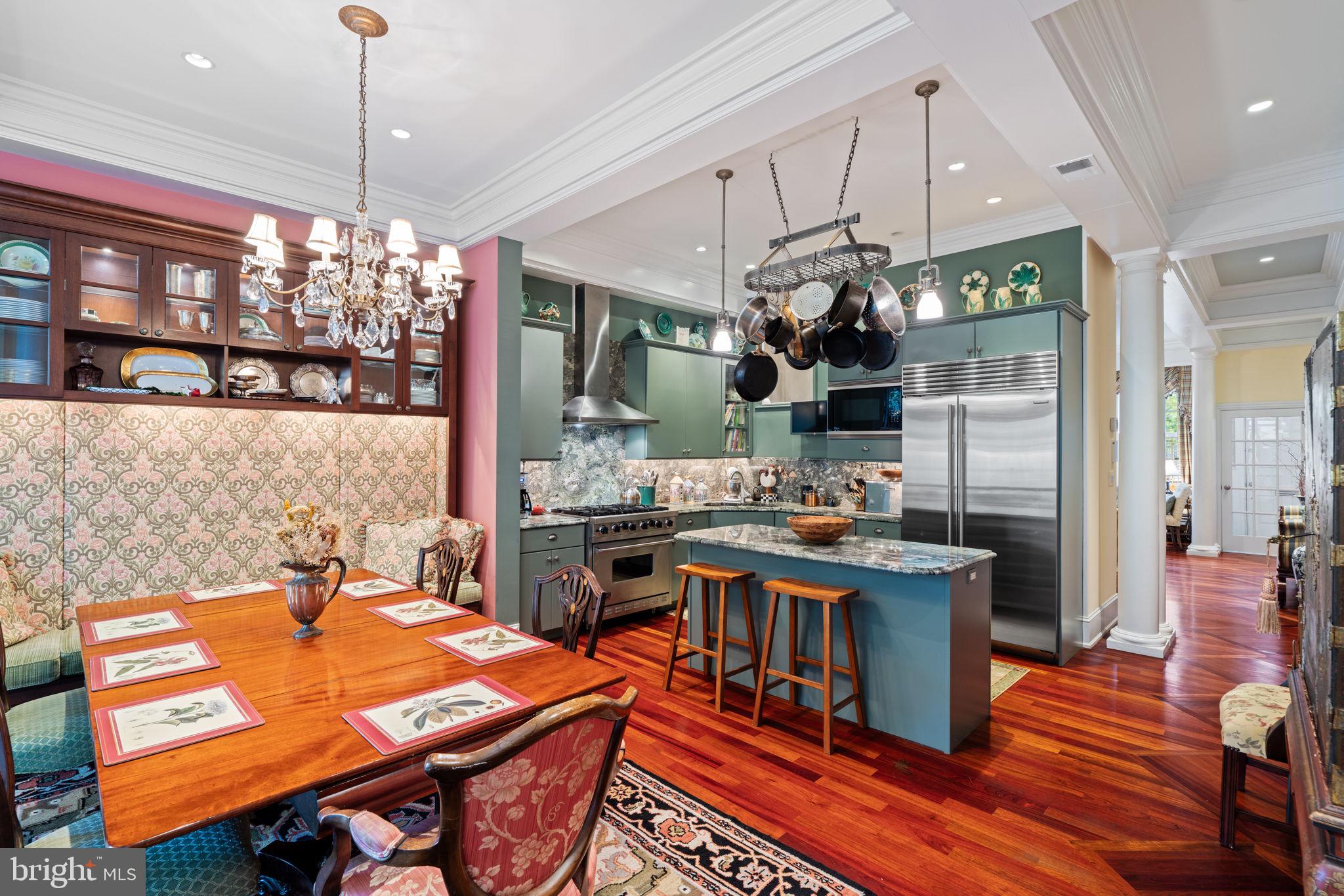 501 Pine Street Philadelphia, PA 19106 - Photo 9 of 52 a kitchen with a table chairs and a chandelier