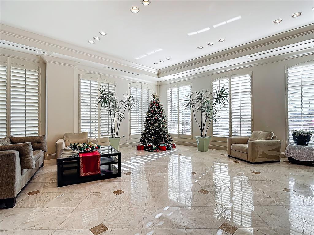 2745 First Street, Unit 111 Fort Myers, FL 33916 - Photo 44 of 79 a living room filled with furniture and a flat screen tv