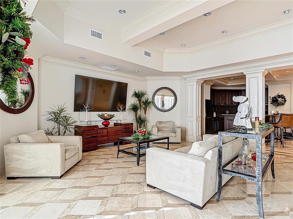 2745 First Street, Unit 111 Fort Myers, FL 33916 - Photo 46 of 79 a living room with furniture and a flat screen tv