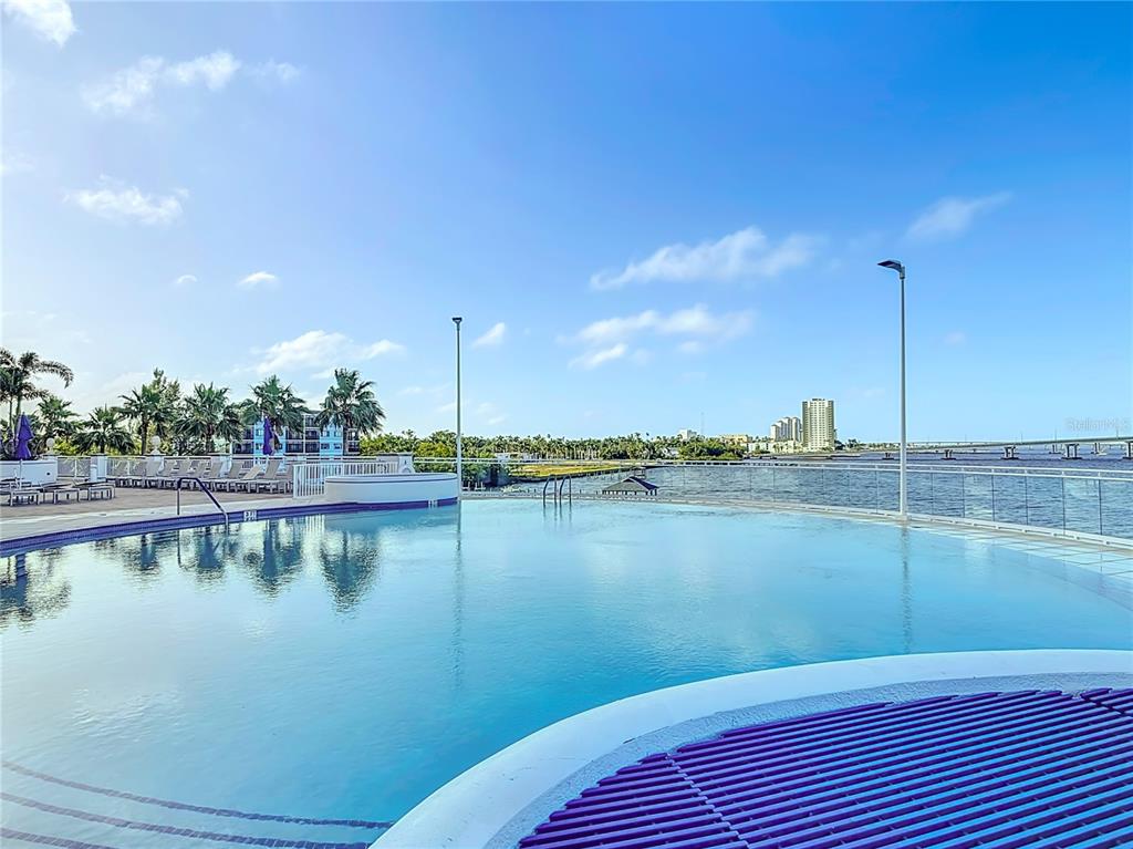 2745 First Street, Unit 111 Fort Myers, FL 33916 - Photo 60 of 79 a view of a lake with houses in the background
