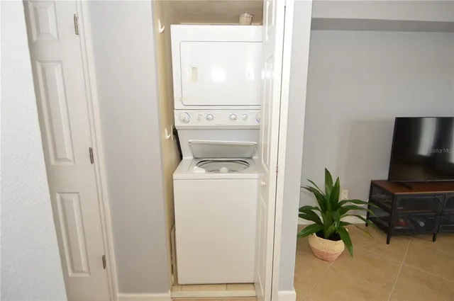 an aerial view of house with yard swimming pool and outdoor seating