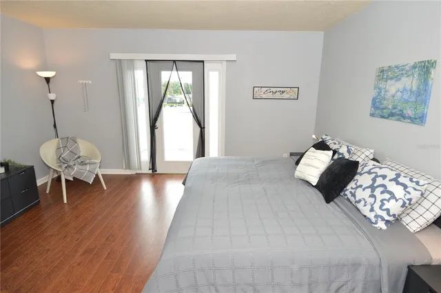 a dining room with furniture and a flat screen tv