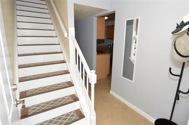 a kitchen with granite countertop a sink and a stove top oven