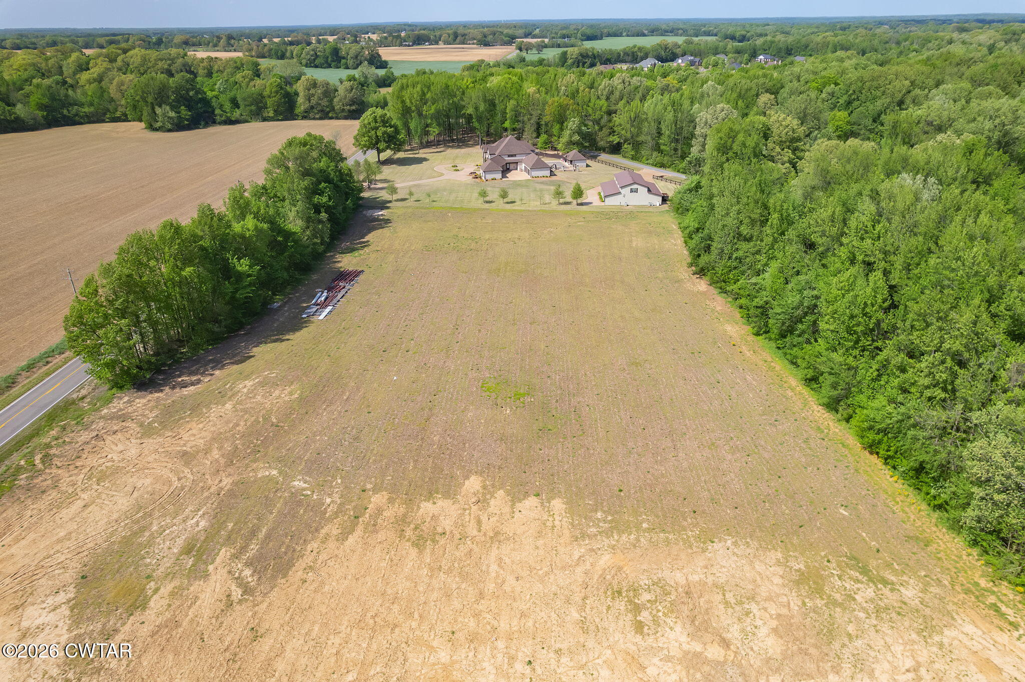 0 Windy City Road Jackson, TN 38305 - Photo 17 of 24 a view of a swimming pool with a yard