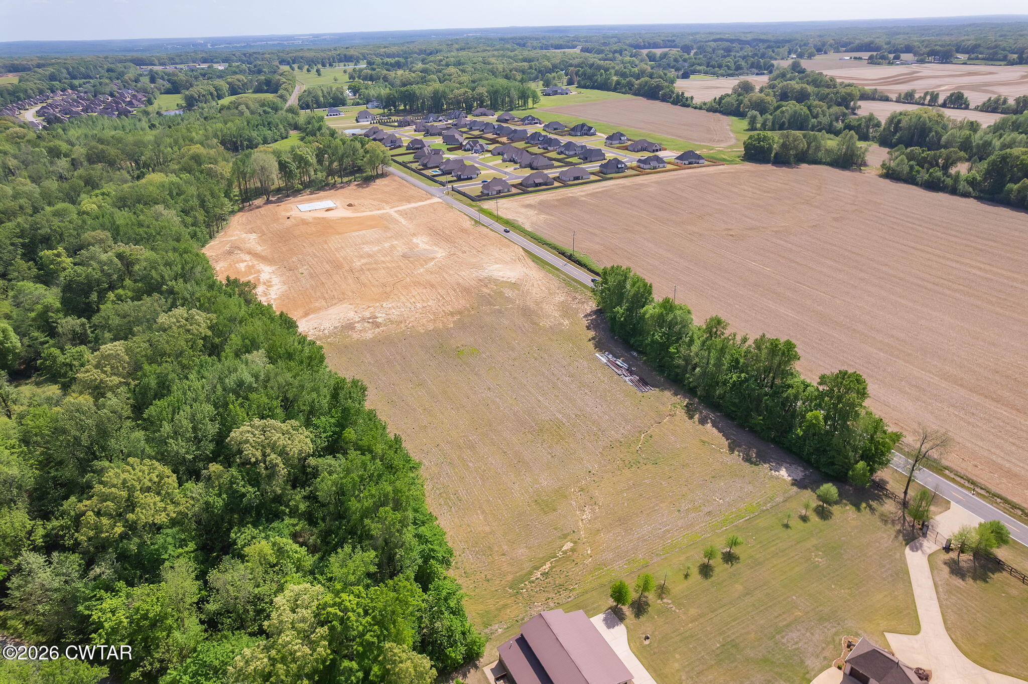 0 Windy City Road Jackson, TN 38305 - Photo 8 of 24 an aerial view of a house with a yard and lake view