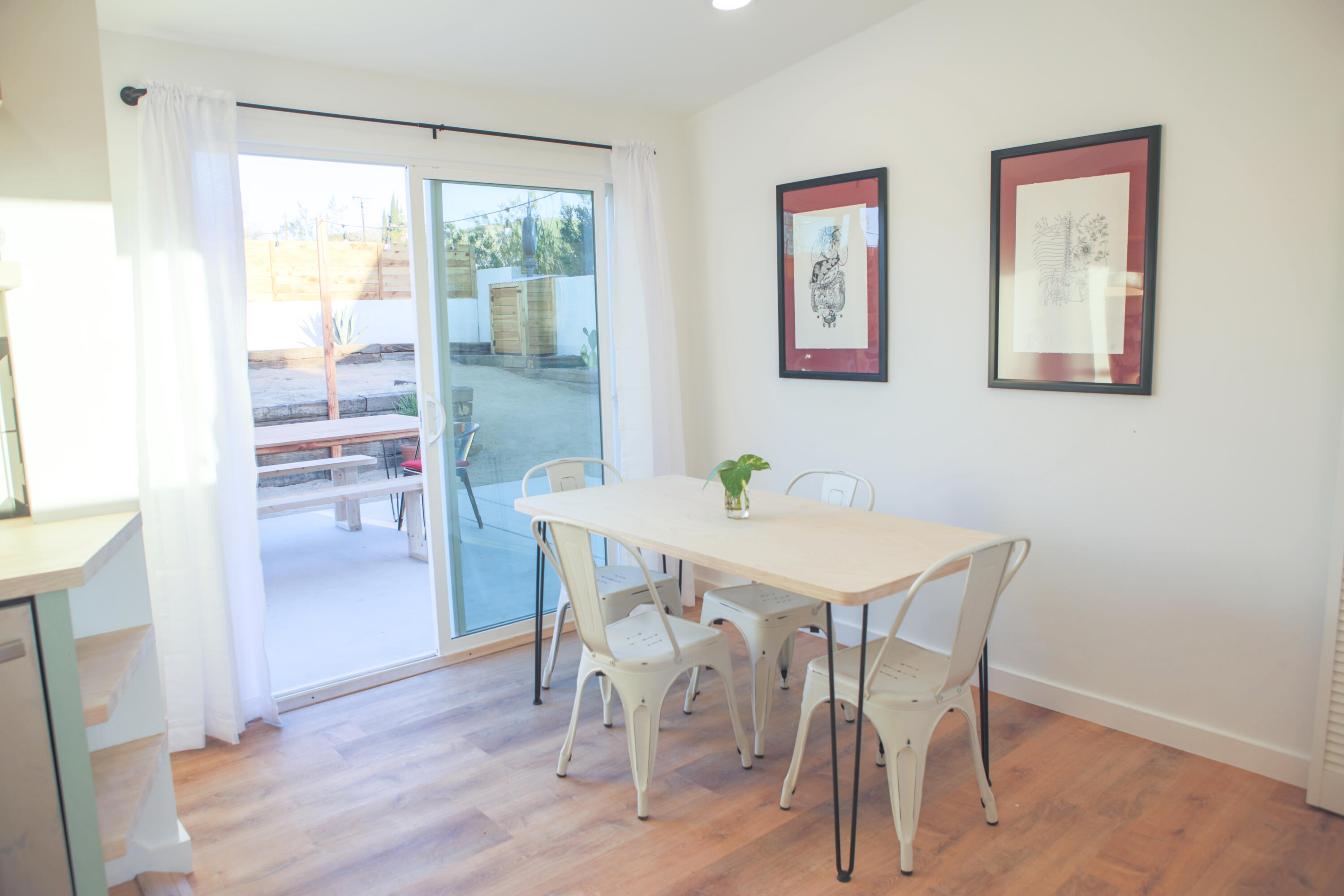6126 Panorama Road Joshua Tree, CA 92252 - Photo 23 of 31 a view of a dining room with furniture window and wooden floor