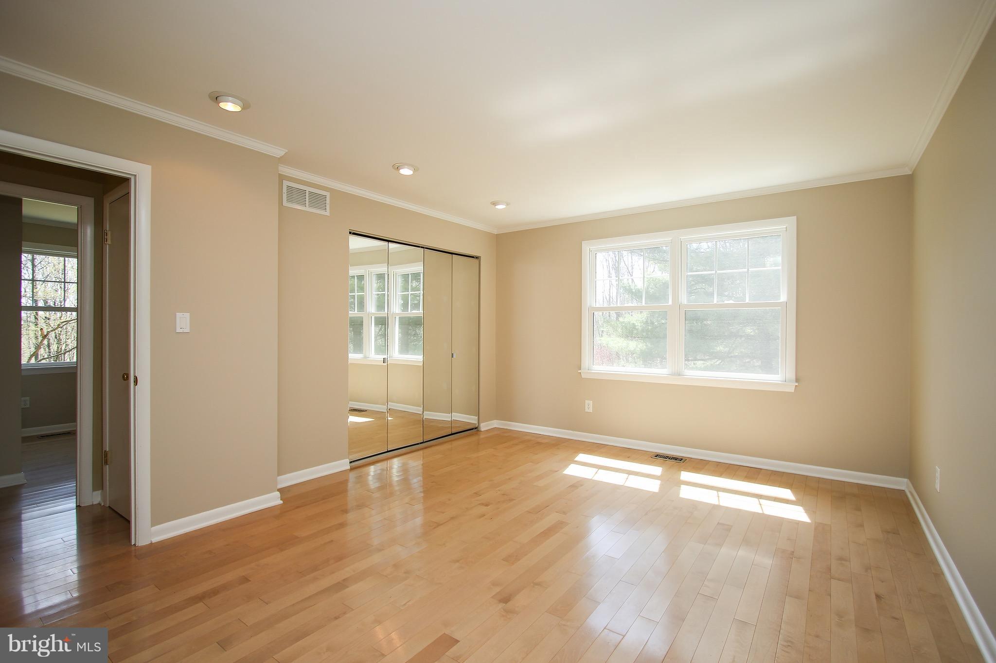 300 Warfieldsburg Road Westminster, MD 21157 - Photo 14 of 30 an empty room with wooden floor and windows