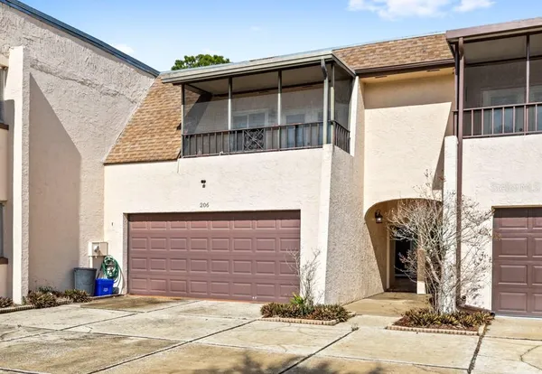 a front view of a house with garage