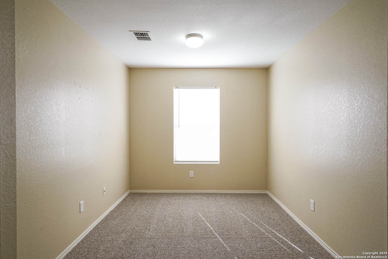438 Walnut Crest Selma, TX 78154 - Photo 28 of 33 an empty room with a window and a mirror