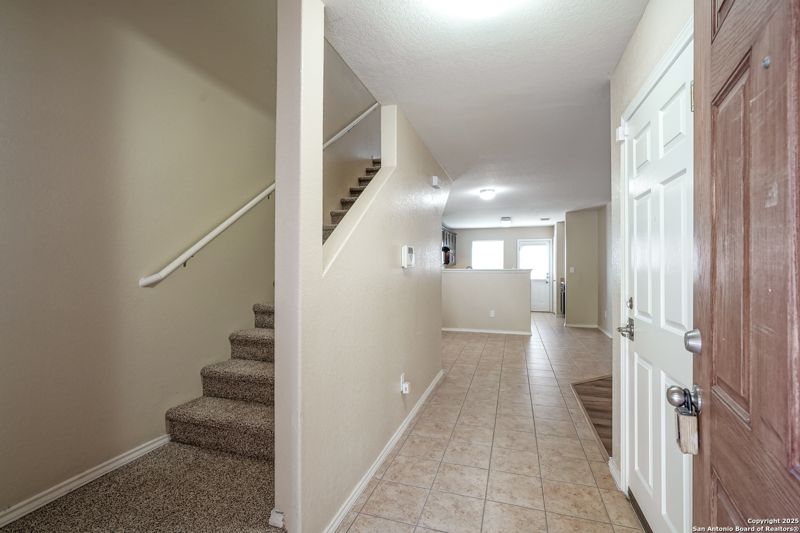 438 Walnut Crest Selma, TX 78154 - Photo 5 of 33 a view of a hallway with wooden floor and entryway