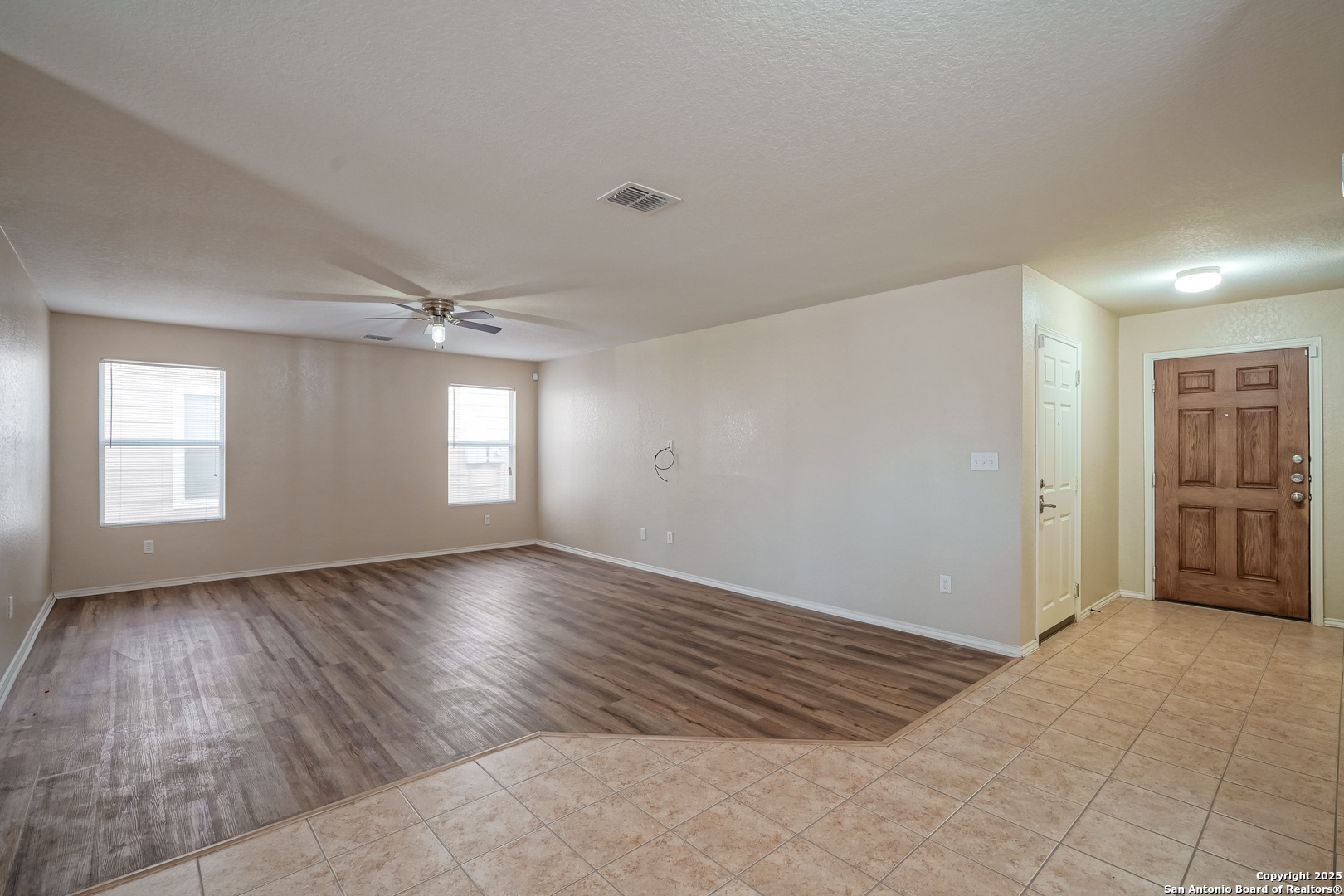 438 Walnut Crest Selma, TX 78154 - Photo 8 of 33 a view of empty room with wooden floor and window