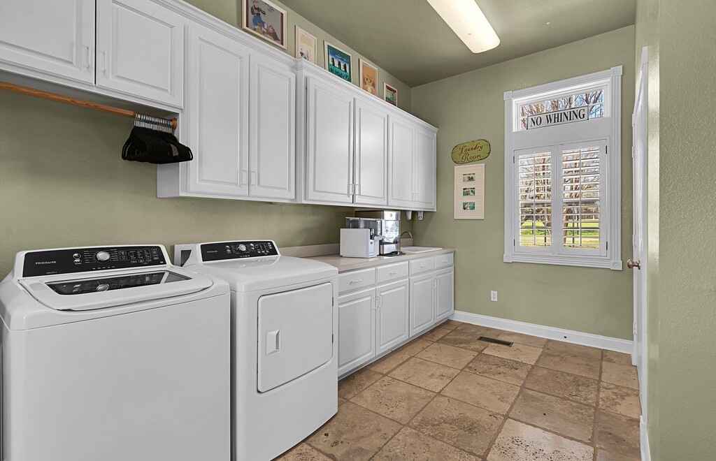675 Cedar Canyon Road Crawford, TX 76638 - Photo 21 of 95 a utility room with closet dryer and washer