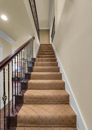 a view of a house with a backyard porch and sitting area