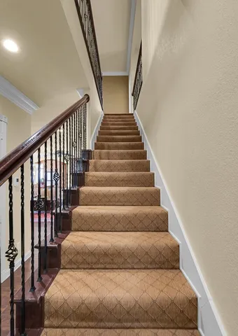 a view of a house with a backyard porch and sitting area