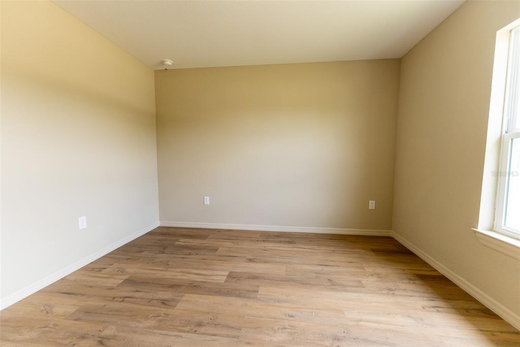 14686 Southwest 79th Avenue Road Ocala, FL 34473 - Photo 34 of 42 a view of an empty room and window