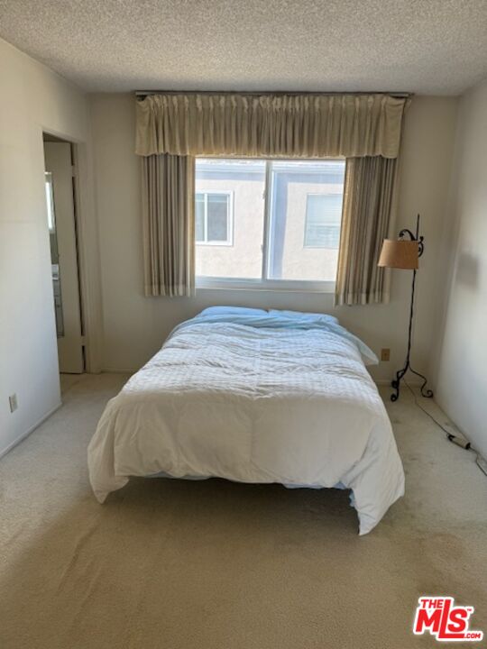 4351 Alla Road, Unit 8 Marina del Rey, CA 90292 - Photo 12 of 31 a bedroom with a bed and a window
