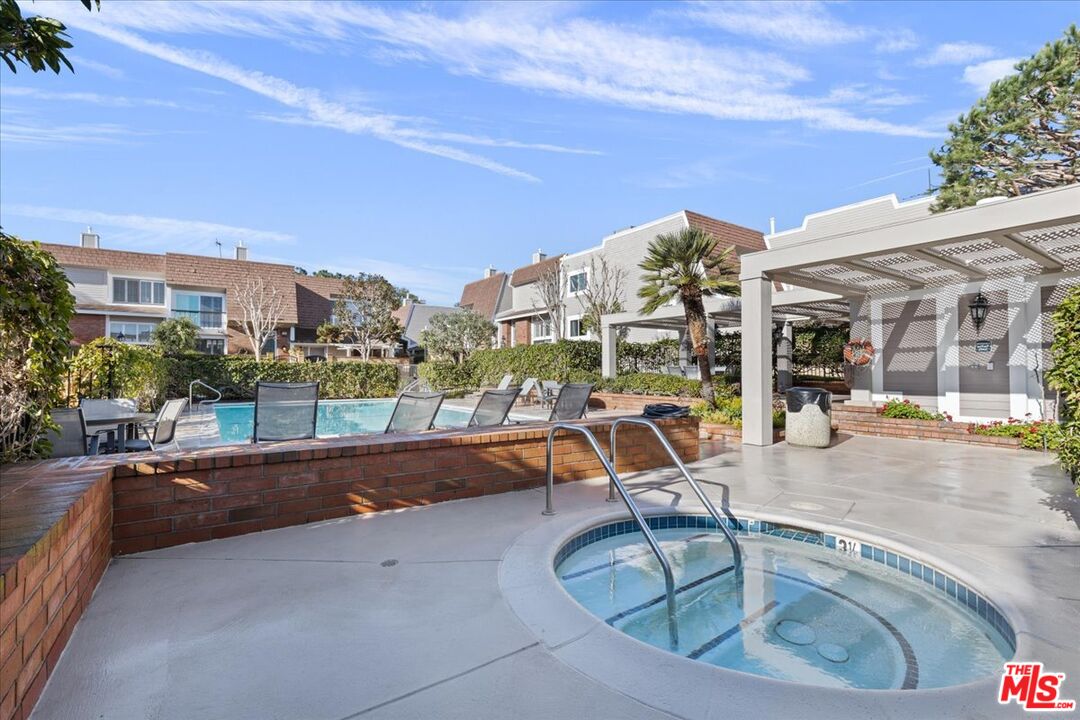 4351 Alla Road, Unit 8 Marina del Rey, CA 90292 - Photo 14 of 31 a view of a swimming pool with a lounge chair