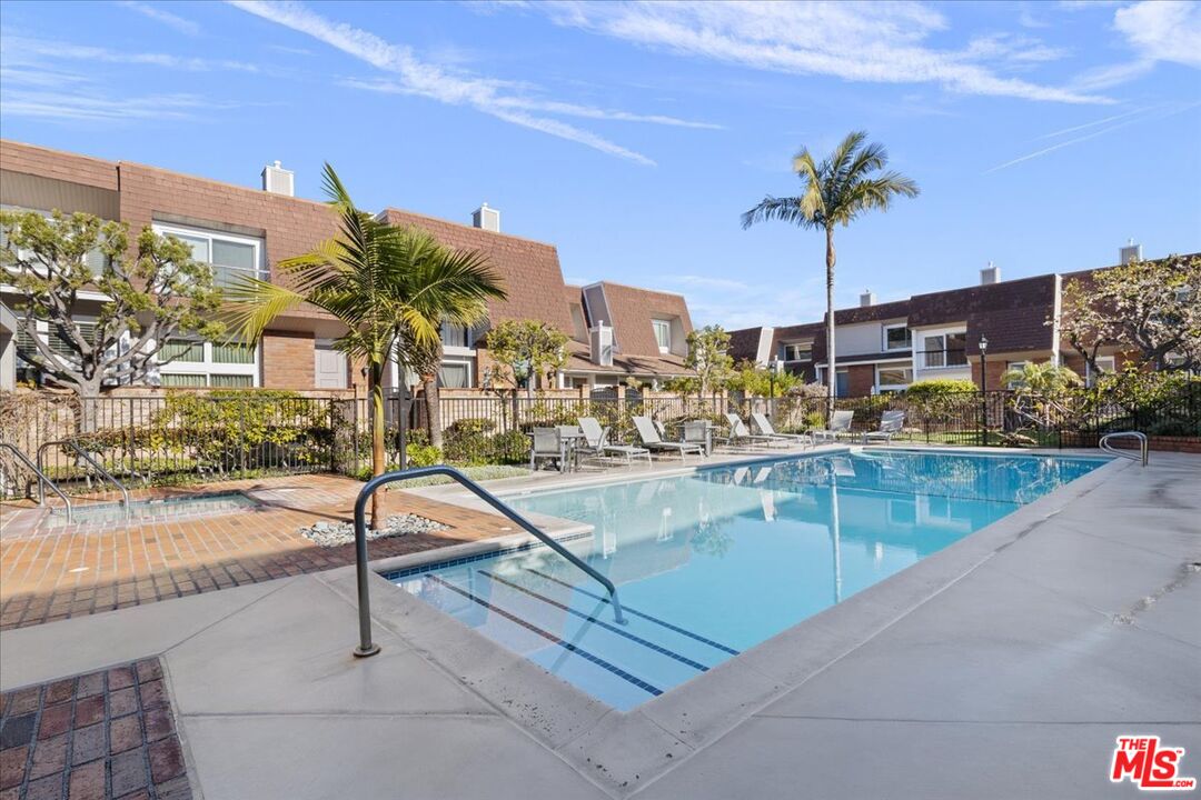4351 Alla Road, Unit 8 Marina del Rey, CA 90292 - Photo 17 of 31 a view of swimming pool with a table and chairs