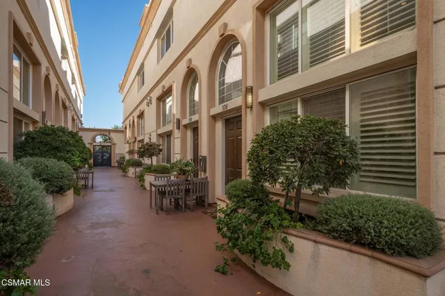 a view of a building with a garden