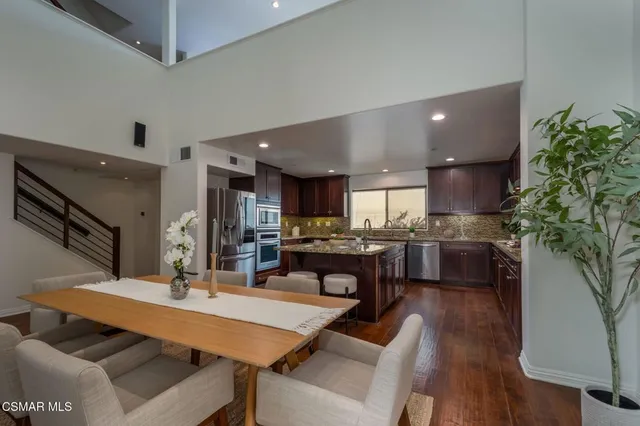 a kitchen with a table and chairs in it