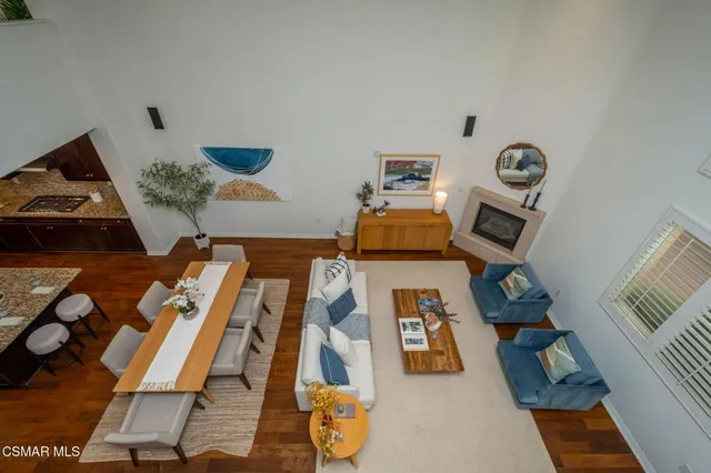 view of living room with furniture and floor to ceiling window
