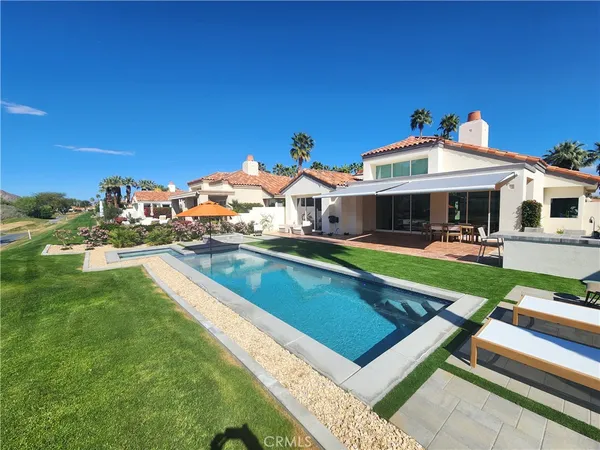 a view of swimming pool from a yard