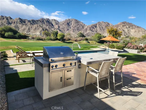 a view of a swimming pool with a yard