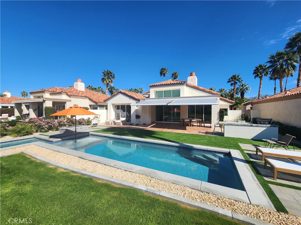 56989 Merion La Quinta, CA 92253 - Photo 21 of 37 a front view of house with yard and swimming pool