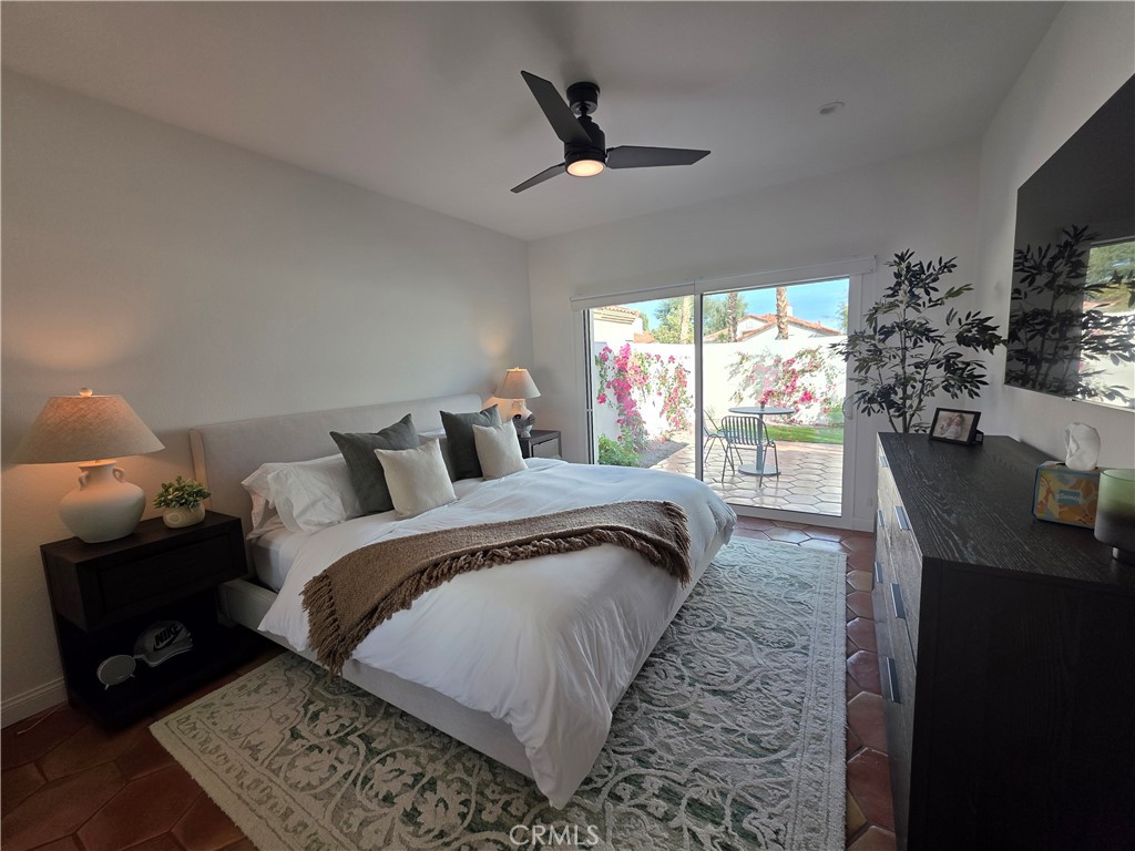 56989 Merion La Quinta, CA 92253 - Photo 26 of 37 a spacious bedroom with a bed and wooden floor