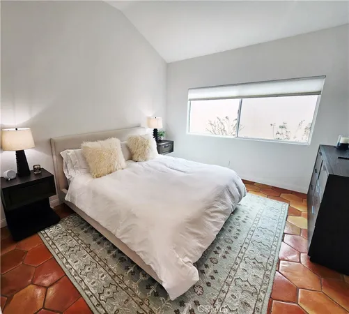 a en suite bathroom with a double vanity sink and a mirror
