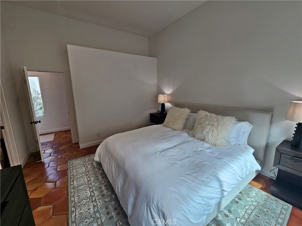 56989 Merion La Quinta, CA 92253 - Photo 29 of 37 a bedroom with a bed and a mirror