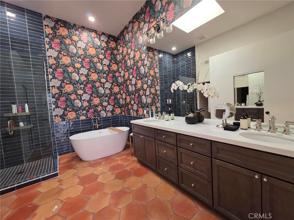 56989 Merion La Quinta, CA 92253 - Photo 31 of 37 a bathroom with a double vanity sink mirror and shower