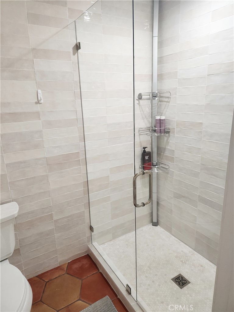 56989 Merion La Quinta, CA 92253 - Photo 33 of 37 a bathroom with a shower and toilet