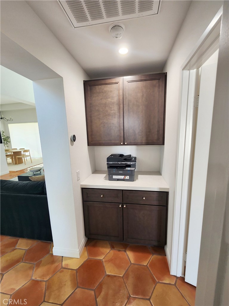 56989 Merion La Quinta, CA 92253 - Photo 36 of 37 a kitchen with stainless steel appliances granite countertop a sink stove and refrigerator