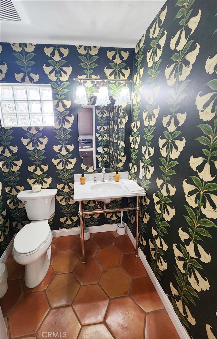 56989 Merion La Quinta, CA 92253 - Photo 37 of 37 a bathroom with a toilet sink and mirror