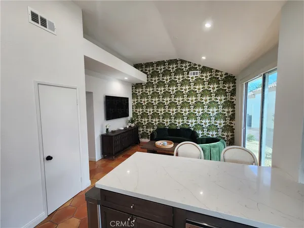 a view of a dining room with furniture wooden floor and chandelier