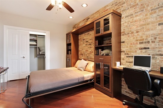 100 Prairie Park Drive, Unit 401 Wheeling, IL 60090 - Photo 11 of 29 a bedroom with a bed and a desk