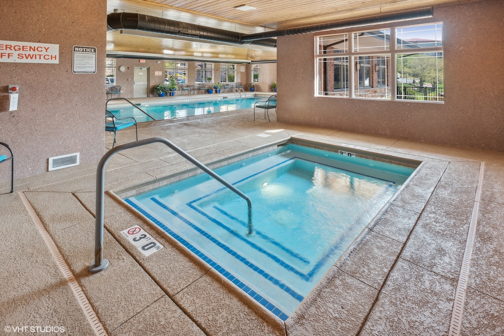100 Prairie Park Drive, Unit 401 Wheeling, IL 60090 - Photo 23 of 29 a view of a balcony with two chairs and a couch