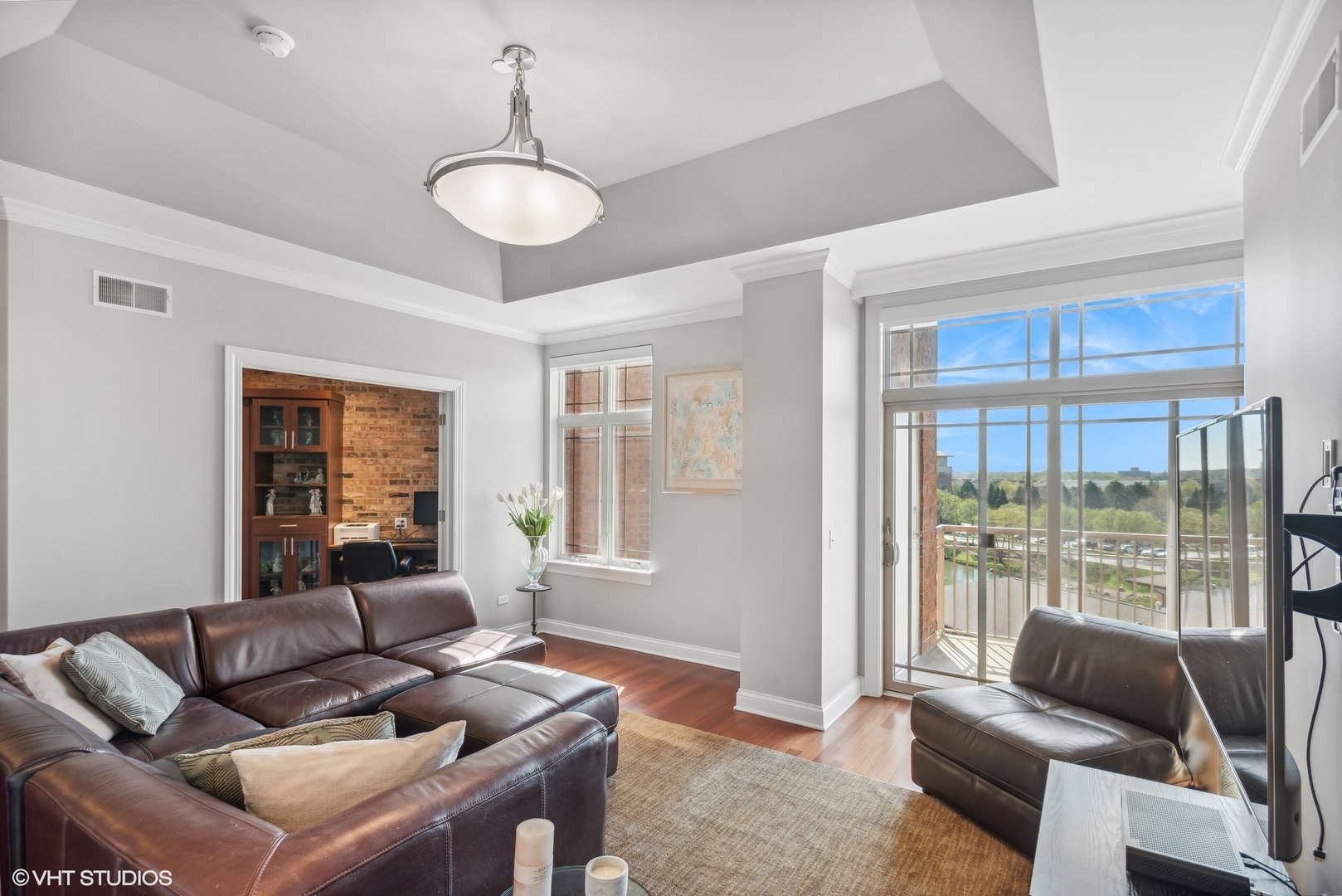 100 Prairie Park Drive, Unit 401 Wheeling, IL 60090 - Photo 4 of 29 a living room with furniture and a large window