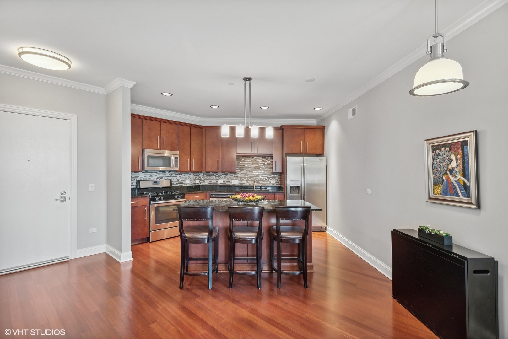 100 Prairie Park Drive, Unit 401 Wheeling, IL 60090 - Photo 6 of 29 a view of a dining room with furniture window and wooden floor