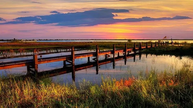 a view of a swimming pool with a table and chairs