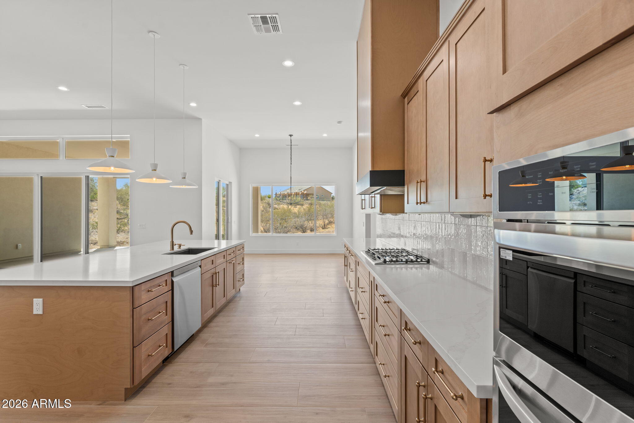 2855 Percheron Road Wickenburg, AZ 85390 - Photo 26 of 58 a large kitchen with stainless steel appliances and a sink