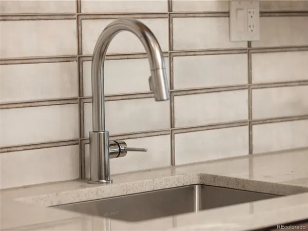 a bathroom with a shower and a sink