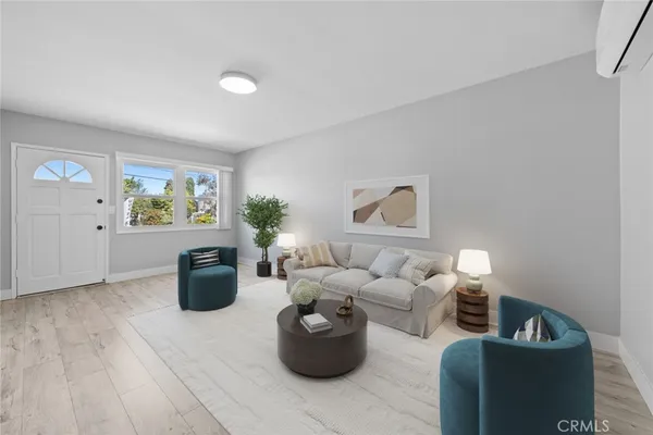 a kitchen with stainless steel appliances a stove a microwave and wooden floors