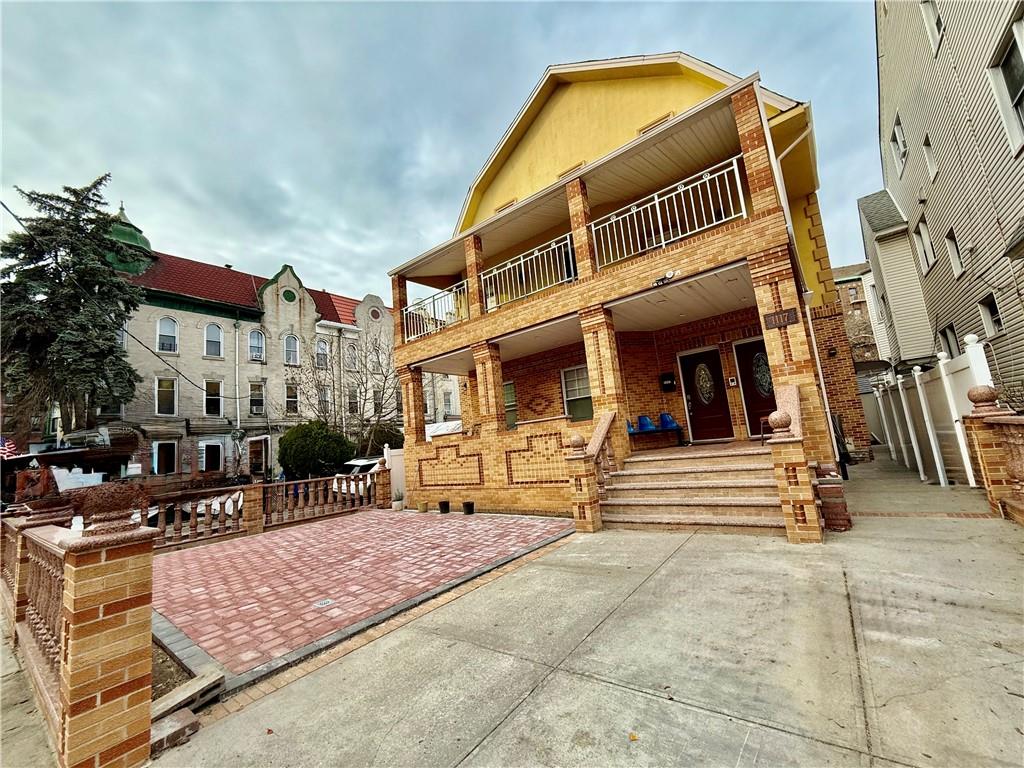 a view of a building with sitting area