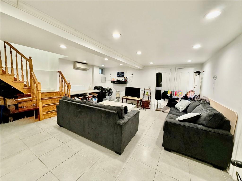 1117 Glenwood Road Brooklyn, NY 11230 - Photo 20 of 28 a living room with furniture a flat screen tv and a sink