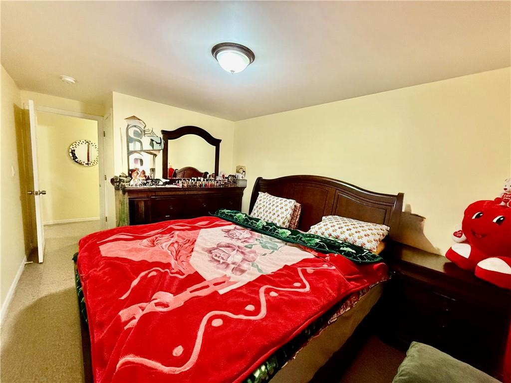 1117 Glenwood Road Brooklyn, NY 11230 - Photo 25 of 28 a bedroom with bed and a dresser