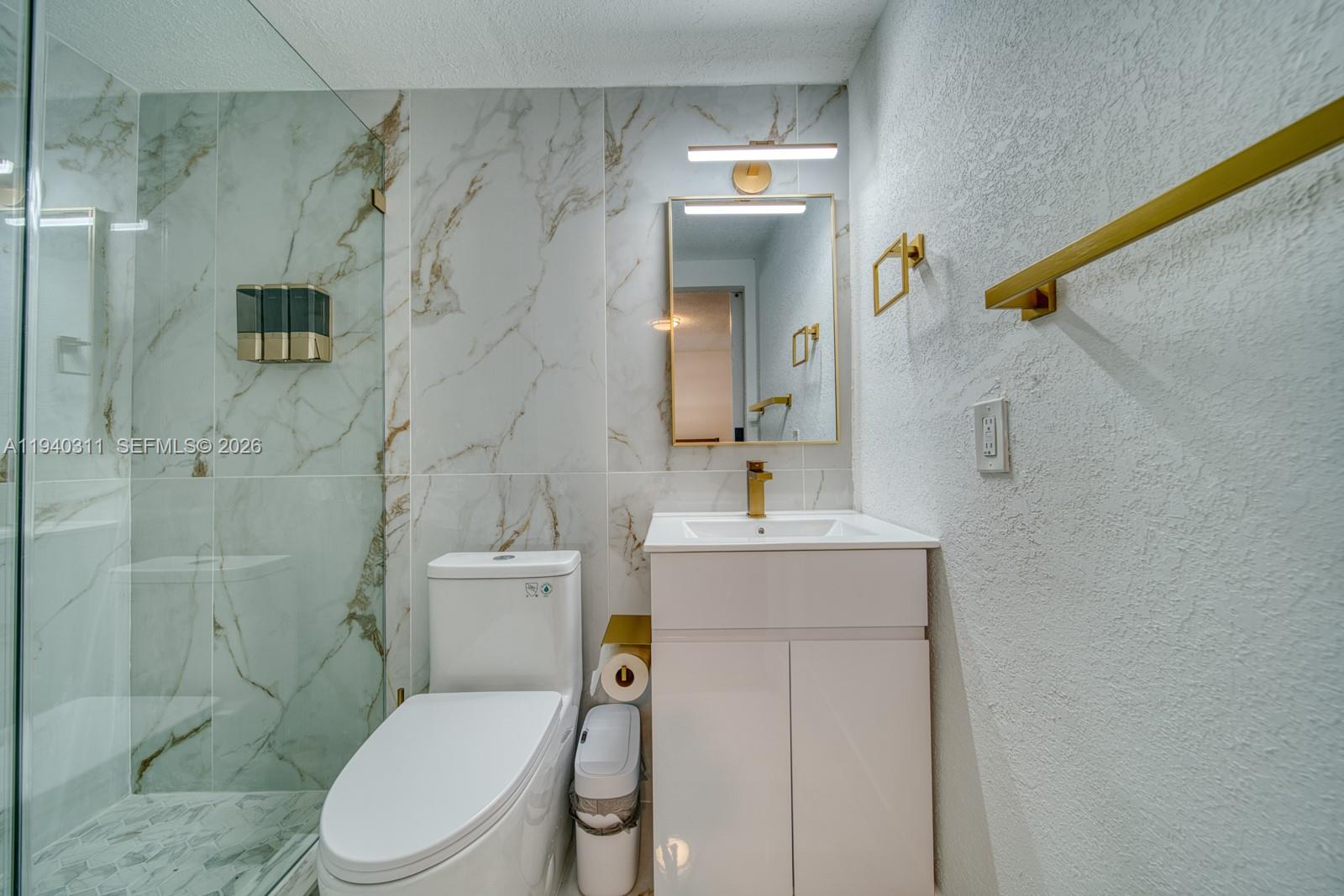 2741 Southwest 67th Avenue, Unit 1 Miami, FL 33155 - Photo 12 of 24 a bathroom with a sink a toilet and shower